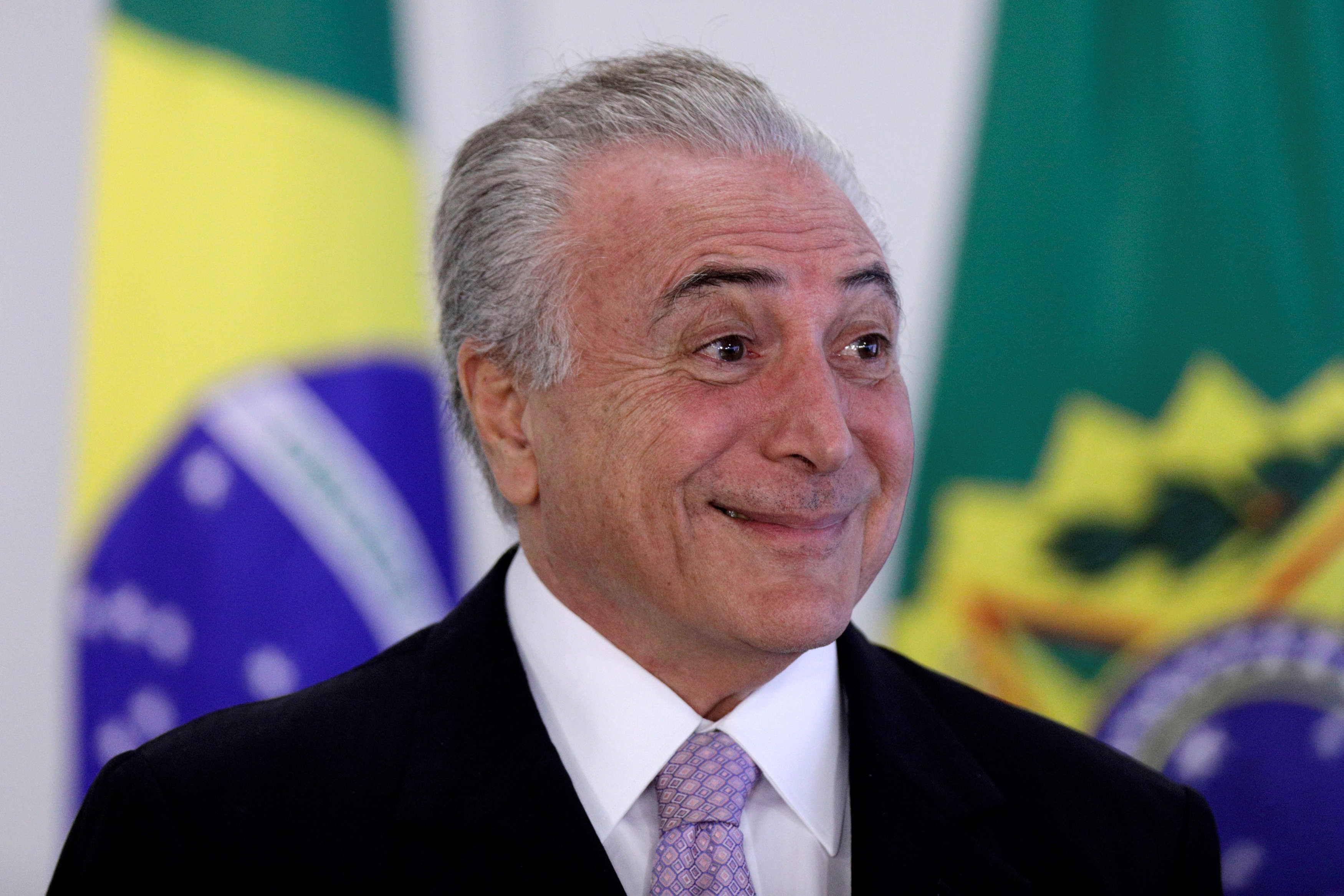 Brazil's President Michel Temer smiles during a signing ceremony of the New Decree of Port Regularization, at the Planalto Palace in Brasilia, Brazil May 10, 2017. REUTERS/Ueslei Marcelino